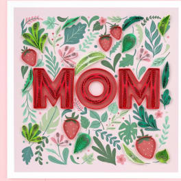 Paper art with the word MOM surrounded by strawberries and leaves