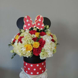 Mickey Mouse-themed flower arrangement in a polka-dot box