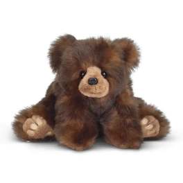 Fluffy brown plush teddy bear with tan face and paws sitting upright