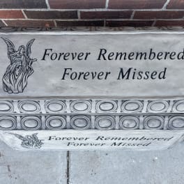 Stone memorial box with the words Forever Remembered Forever Missed