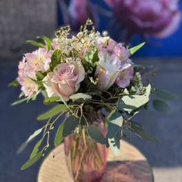 Pink and white bouquet in a glass vase