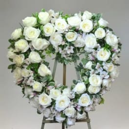 White rose wreath on a standing easel