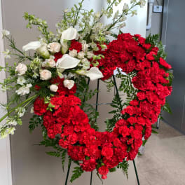 Heart-shaped red carnation wreath with white calla lilies and roses