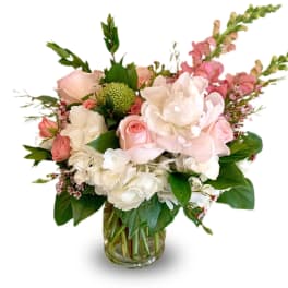 Pink and white bouquet in a clear glass vase