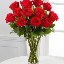 Bouquet of red roses in a clear glass vase