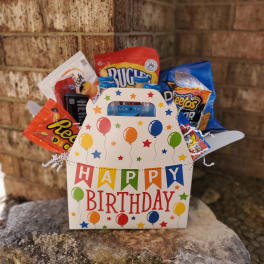 Birthday gift basket with assorted snacks in a decorated box