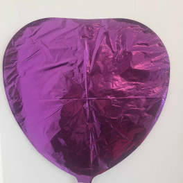 Purple heart-shaped foil balloon on a white background