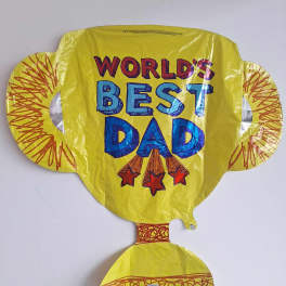 Yellow foil balloon reading "World's Best Dad"