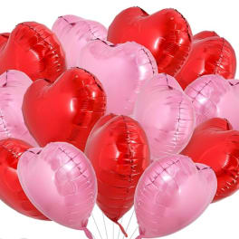 Cluster of red and pink heart-shaped balloons