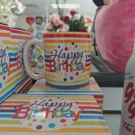 Birthday mug and matching gift box with colorful stripes and polka dots