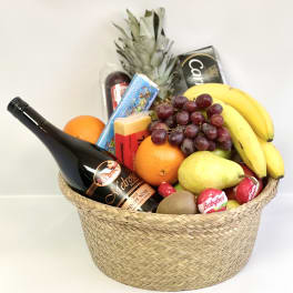 Gift basket with wine, fruit, cheese, and chocolates