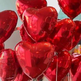 Cluster of red heart-shaped balloons