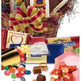 Gift basket with chocolates, candy, and ribbon decorations