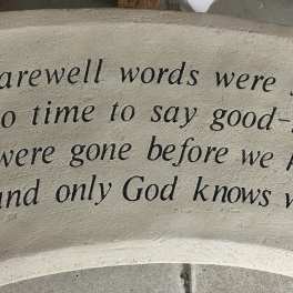 Memorial plaque with a farewell quote