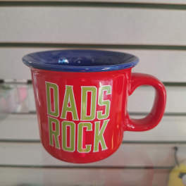Red mug with blue rim and "DADS ROCK" text