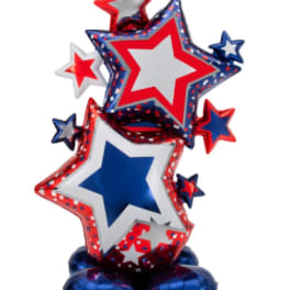 Red, white, and blue star-shaped balloons arranged in a festive cluster