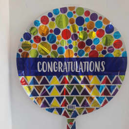 Round foil balloon with colorful dots and the word Congratulations
