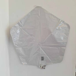 Silver foil balloon shaped like a leaf or tree