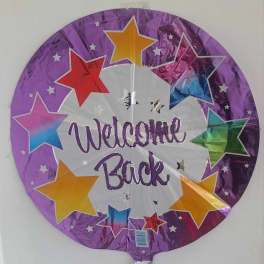 Round purple foil balloon with stars and the words Welcome Back