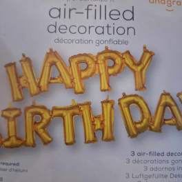 Gold birthday letter balloons on product packaging