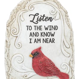 Decorative stone plaque with a red cardinal and memorial text