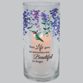 Glass memorial candle holder with purple flowers and a hummingbird design