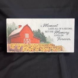 Memorial card with a red barn and a field of sunflowers