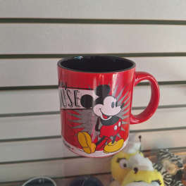 Red Mickey Mouse mug with a black interior on a shelf