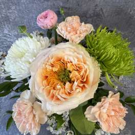 Bouquet of peach, pink, white, and green flowers