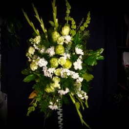 Tall green and white floral spray with mixed blooms