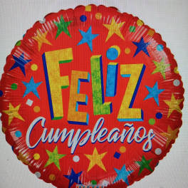 Round red birthday balloon with stars and the words Feliz Cumpleaños