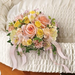 Pastel bouquet of roses and alstroemeria with pink ribbons