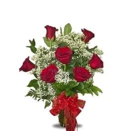 Bouquet of red roses with baby's breath and a red ribbon