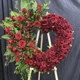 Large red rose wreath on a standing easel