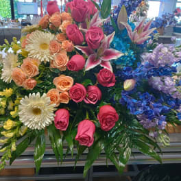 Large mixed bouquet with pink roses, white daisies, and blue flowers
