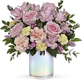 Pink and lavender bouquet in an iridescent glass vase