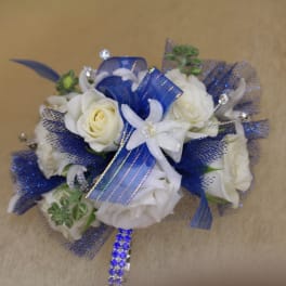 White roses with blue ribbon and mesh accents