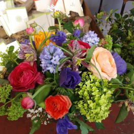 Colorful mixed bouquet with ranunculus, hyacinth, and lilies