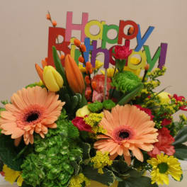 Colorful birthday bouquet with gerbera daisies and tulips
