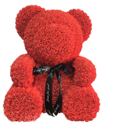 Red rose teddy bear with a black ribbon bow
