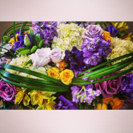 Mixed bouquet of purple, white, and yellow flowers