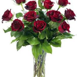 Bouquet of red roses in a clear glass vase