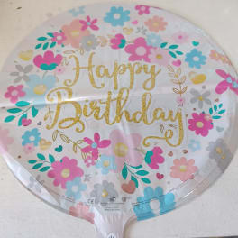 Round birthday balloon with colorful flowers and gold lettering