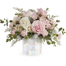 Pink and white rose arrangement in a mosaic ceramic vase