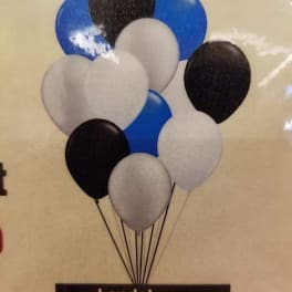 Cluster of black, white, and blue balloons tied together
