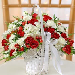 Red and white flower basket with a white ribbon