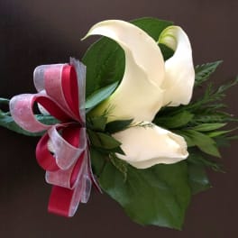 White calla lily bouquet with red and silver ribbon