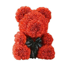 Red rose teddy bear with a black ribbon bow