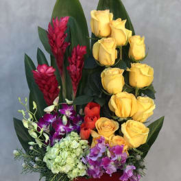 Bouquet of yellow roses, red ginger, and purple orchids in a red container