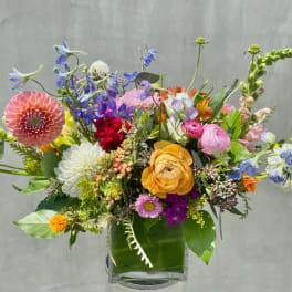 Colorful mixed bouquet in a clear glass vase